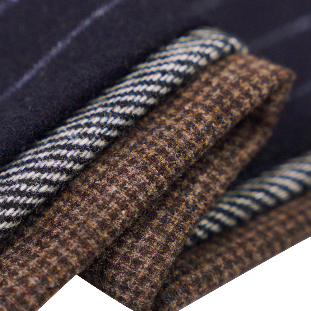 50% wol, 30% polyester, 20% andere vezels, 320 g/ml, gebroken wit + zwart, twill flanellen stof, ML-C-22104